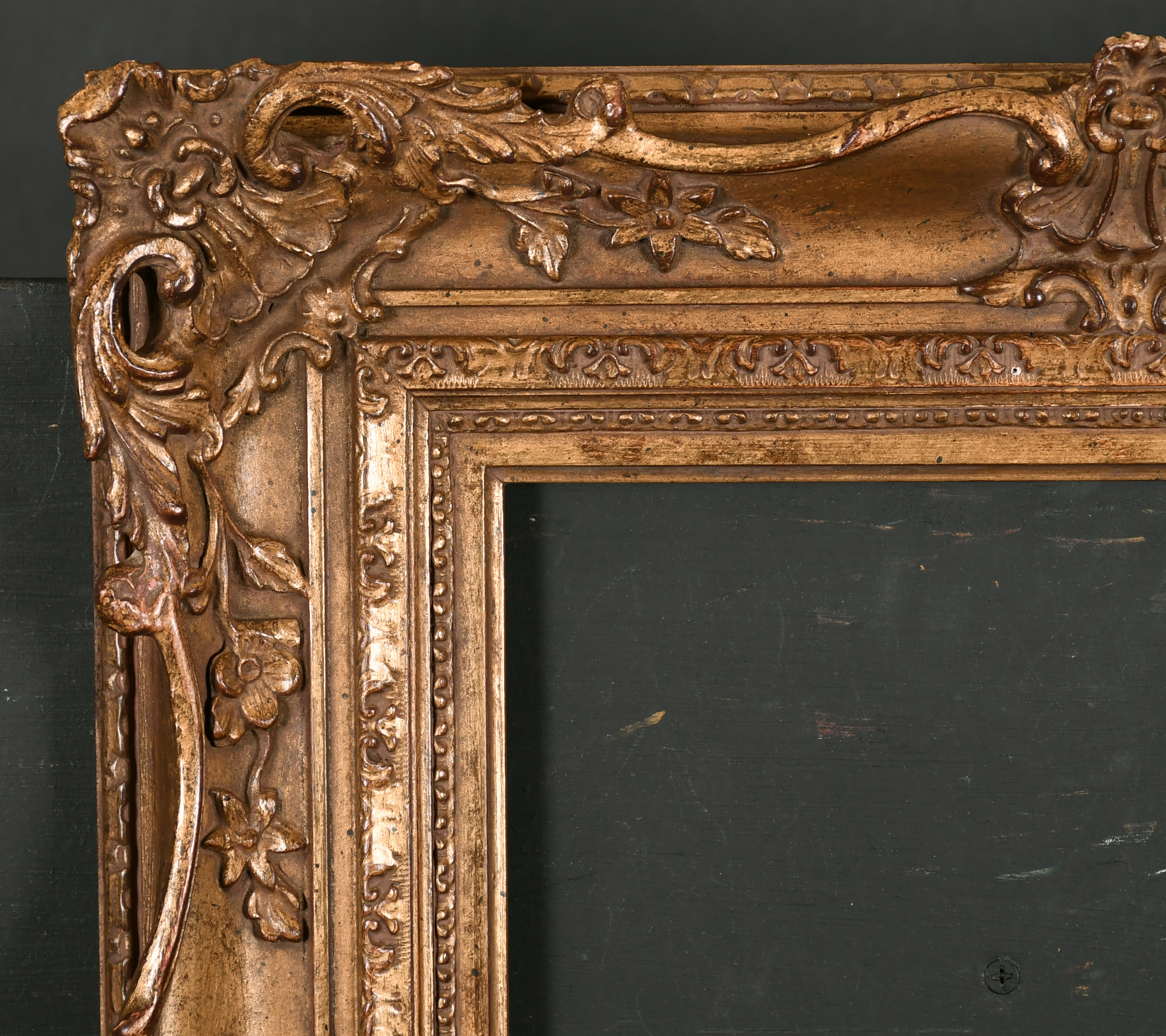 20th Century English School. A Gilt Composition Frame, with swept centres and corners, rebate 14"
