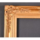 20th Century English School. A Gilt Composition Frame with swept and pierced centres and corners,