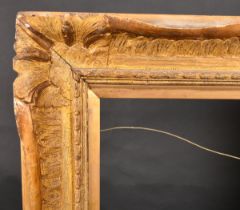 19th Century English School. A Carved Giltwood Frame with swept centres and corners, rebate 36" x