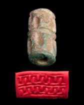 EGYPTIAN GLAZED STEATITE CYLINDER SEAL INSCRIBED WITH AMENEMHAT III