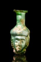 ROMAN GREEN GLASS JANUS HEAD FLASK