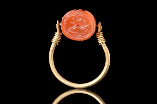 ETRUSCAN CARNELIAN SCARABOID WITH A DOG IN GOLD RING