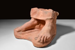 LIFE-SIZE ETRUSCAN TERRACOTTA PAIR OF FEET FROM A STATUE