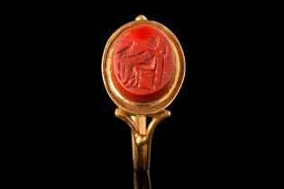 ROMAN RED JASPER INTAGLIO WITH ZEUS SITTING ON A THRONE IN NEOCLASSICAL GOLD RING