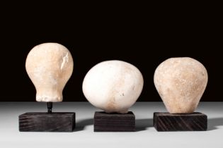 GROUP OF THREE EGYPTIAN ALABASTER MACE HEADS