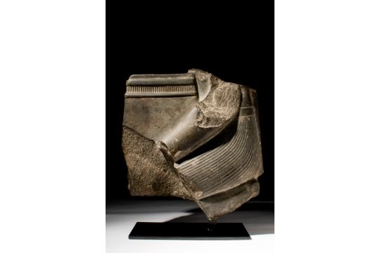 EGYPTIAN GREYWACKE FRAGMENT OF A KNEELING FIGURE - Image 1 of 3