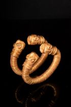 EARLY GREEK PAIR OF BRACELETS WITH LION-HEADED TERMINALS - 130 GRAMS SOLID GOLD
