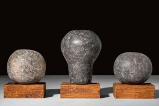 GROUP OF THREE NEAR EASTERN STONE MACES