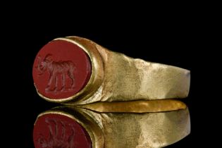 A ROMAN GOLD AND CARNELIAN INTAGLIO RING DEPICTING AN ELEPHANT