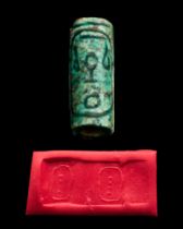 EGYPTIAN FAIENCE CYLINDER SEAL WITH CARTOUCHES