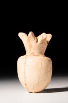 EGYPTIAN CALCITE BOTTLE IN THE FORM OF A POMEGRANATE