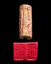 EGYPTIAN GLAZED STEATITE CYLINDER SEAL INSCRIBED WITH AMENEMHAT II