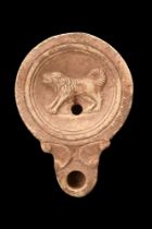 ROMAN TERRACOTTA OIL LAMP WITH A DOG