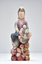 SOAPSTONE SEATED CHILD-GIVING GUANYIN