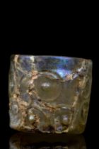 BLOWN GLASS CUP WITH EMBOSSED DECORATION