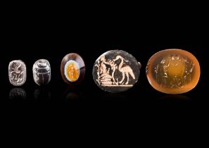 COLLECTION OF TWO INTAGLIOS, A BRONZE RING AND SILVER SCARAB