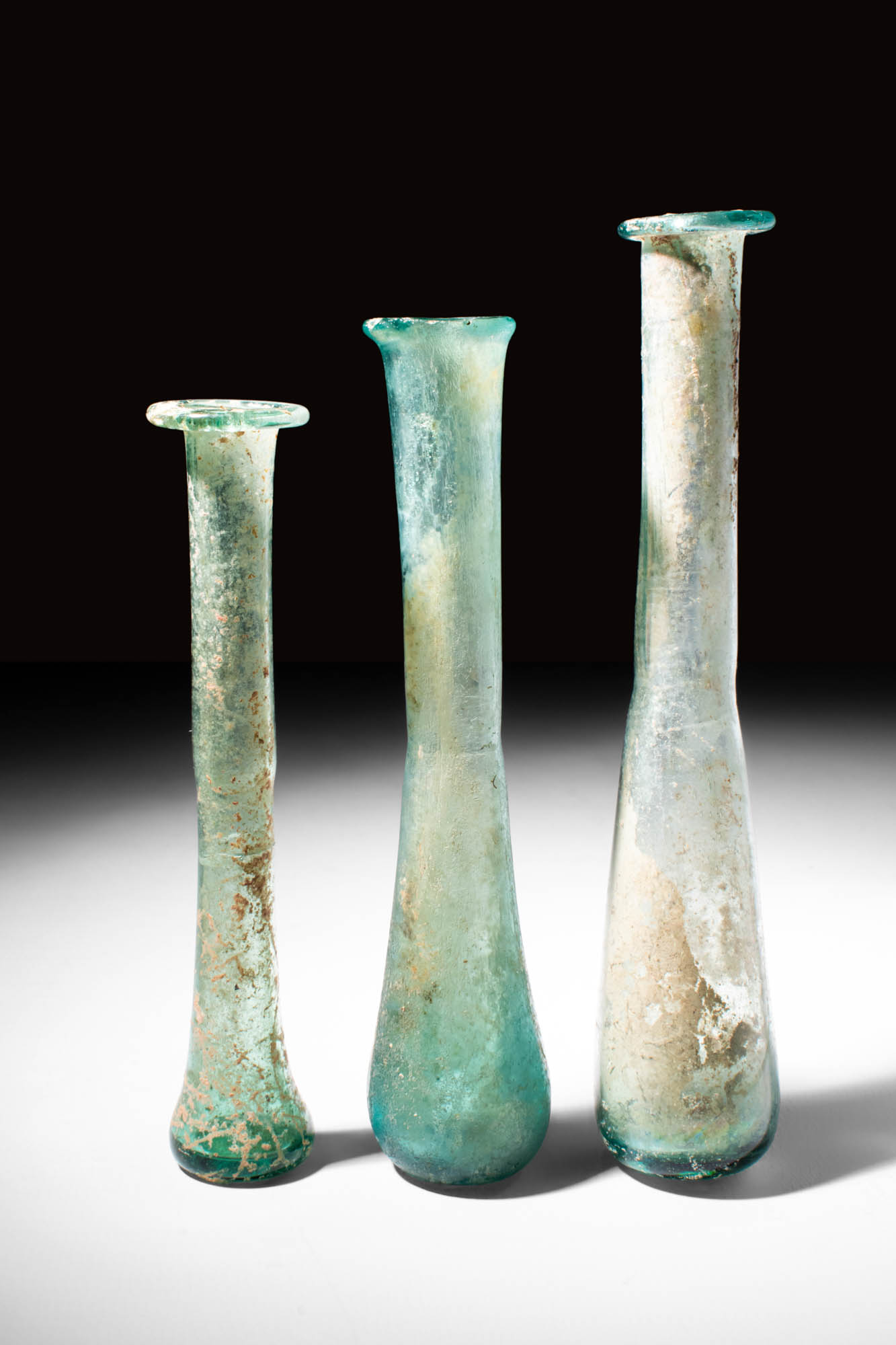 COLLECTION OF THREE ROMAN GLASS VESSELS