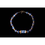 MESOPOTAMIAN NECKLACE WITH AN AKKADIAN LAPIS LAZULI CYLINDER SEAL