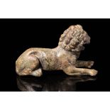 ROMAN BRONZE STATUETTE OF A RECUMBENT LION