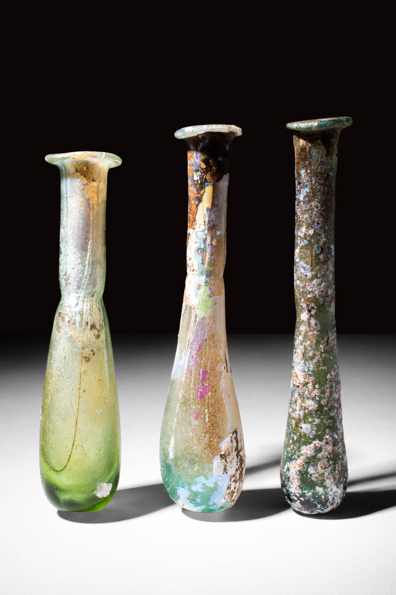 COLLECTION OF THREE ROMAN GLASS VESSELS