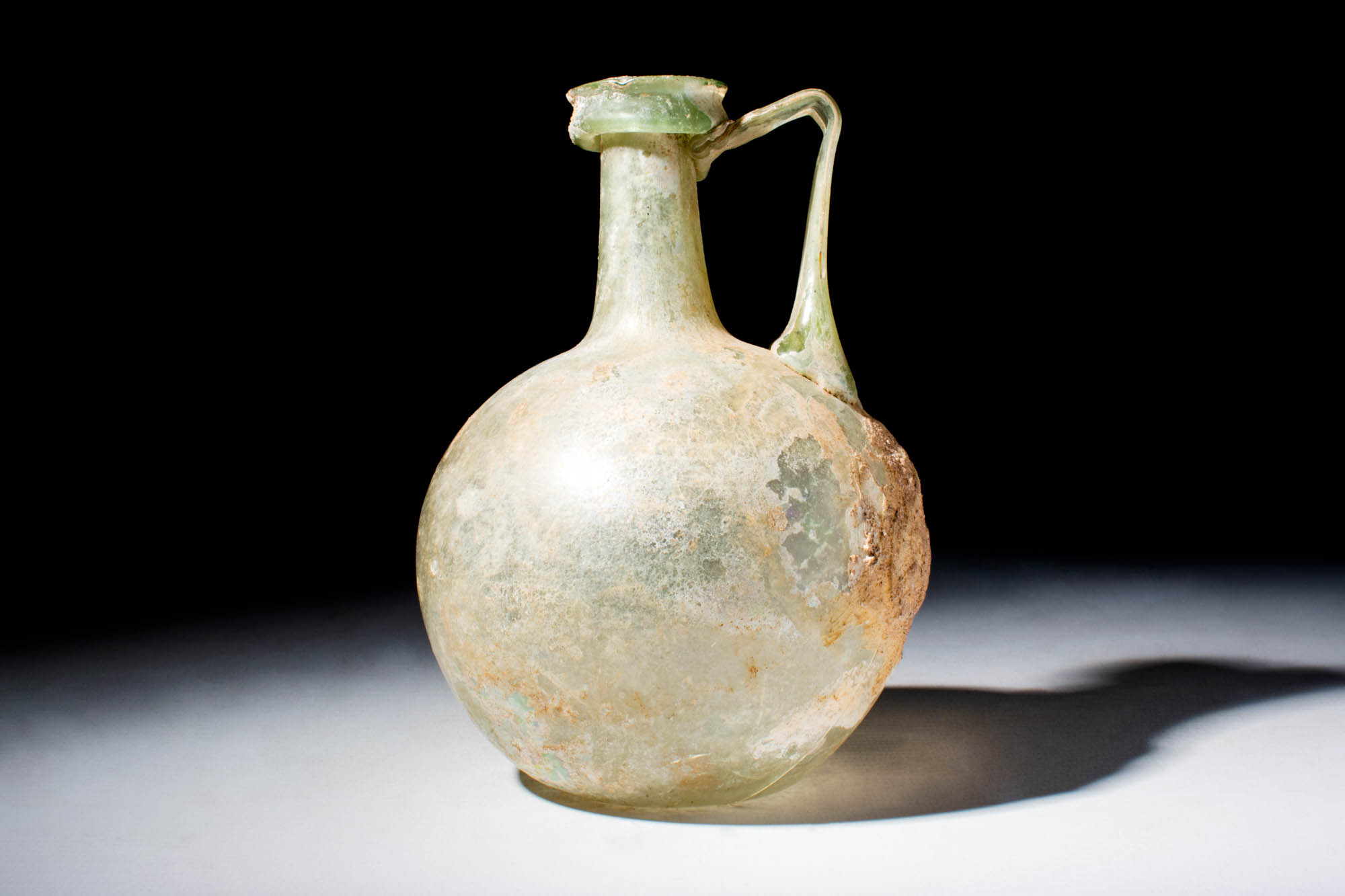 ROMAN GLASS JUG WITH ELEGANT VERTICAL HANDLE