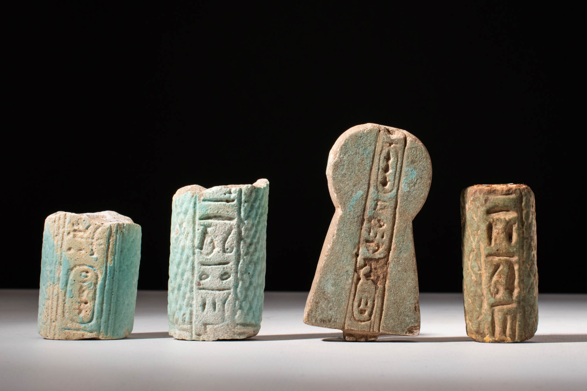 EGYPTIAN PALE GREEN FAIENCE AMULETS
