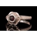 WESTERN EUROPEAN MEDIEVAL SILVER RING WITH RED GLASS CABOCHON