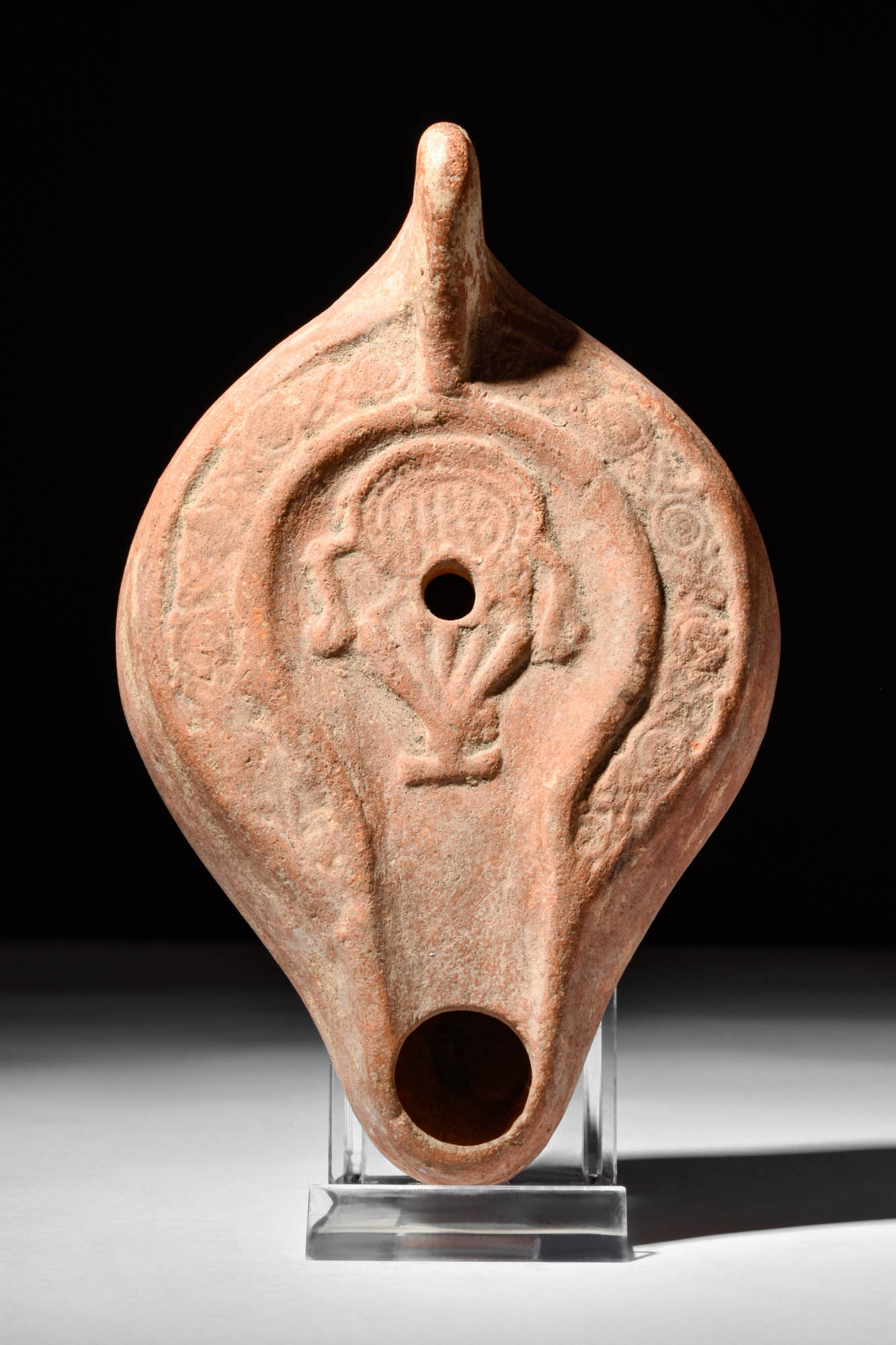 ROMAN TERRACOTTA OIL LAMP WITH A KRATER