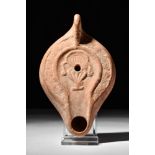 ROMAN TERRACOTTA OIL LAMP WITH A KRATER