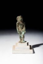 EGYPTIAN BRONZE STATUETTE OF SEATED HARPOCRATES