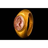 ROMAN GOLD FINGER RING WITH JASPER INTAGLIO DEPICTING A YOUNG WOMAN