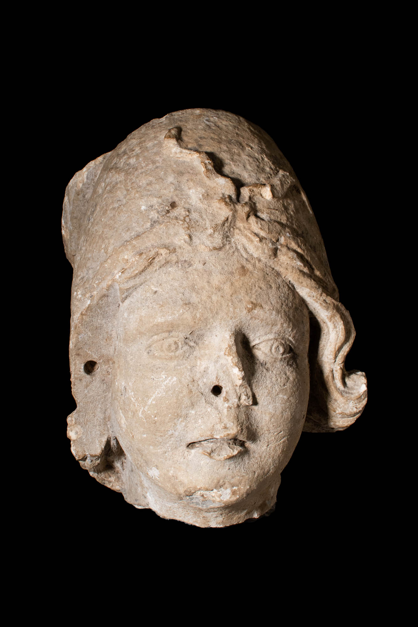 ROMAN MARBLE HEAD OF YOUTH WITH PHRYGIAN HAT