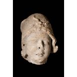 ROMAN MARBLE HEAD OF YOUTH WITH PHRYGIAN HAT