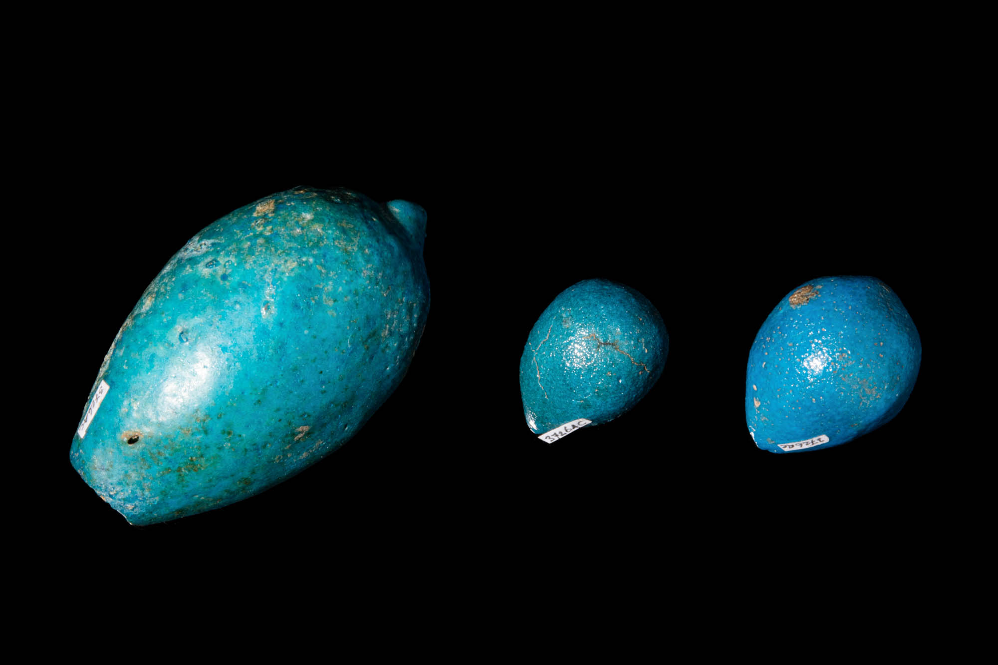 THREE EGYPTIAN TURQUOISE FAIENCE FIG MODELS