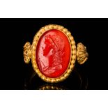 ROMAN CARNELIAN INTAGLIO DEPICTING YOUNG WINNER OF THE GAMES IN GOLD RING