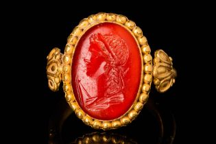 ROMAN CARNELIAN INTAGLIO DEPICTING YOUNG WINNER OF THE GAMES IN GOLD RING