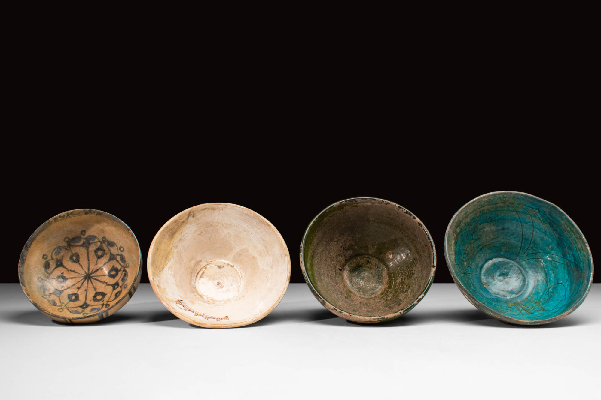 FOUR MEDIEVAL FATIMID GLAZED VESSELS