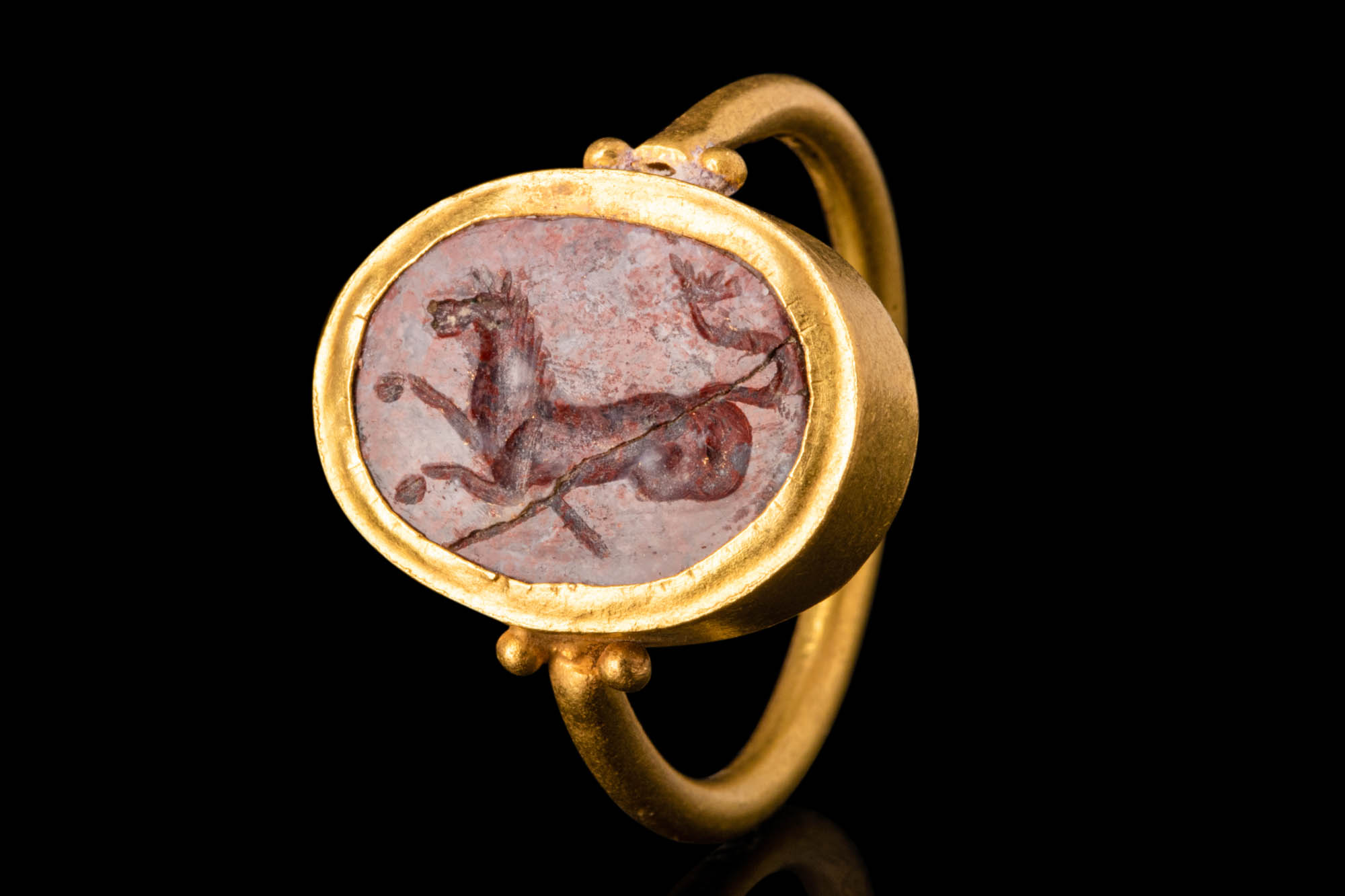 ROMAN GOLD FINGER RING WITH RED JASPER INTAGLIO OF A HIPPOCAMPUS