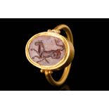 ROMAN GOLD FINGER RING WITH RED JASPER INTAGLIO OF A HIPPOCAMPUS