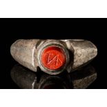 LATE ROMAN SILVER RING WITH INTAGLIO ENGRAVED WITH MONOGRAM