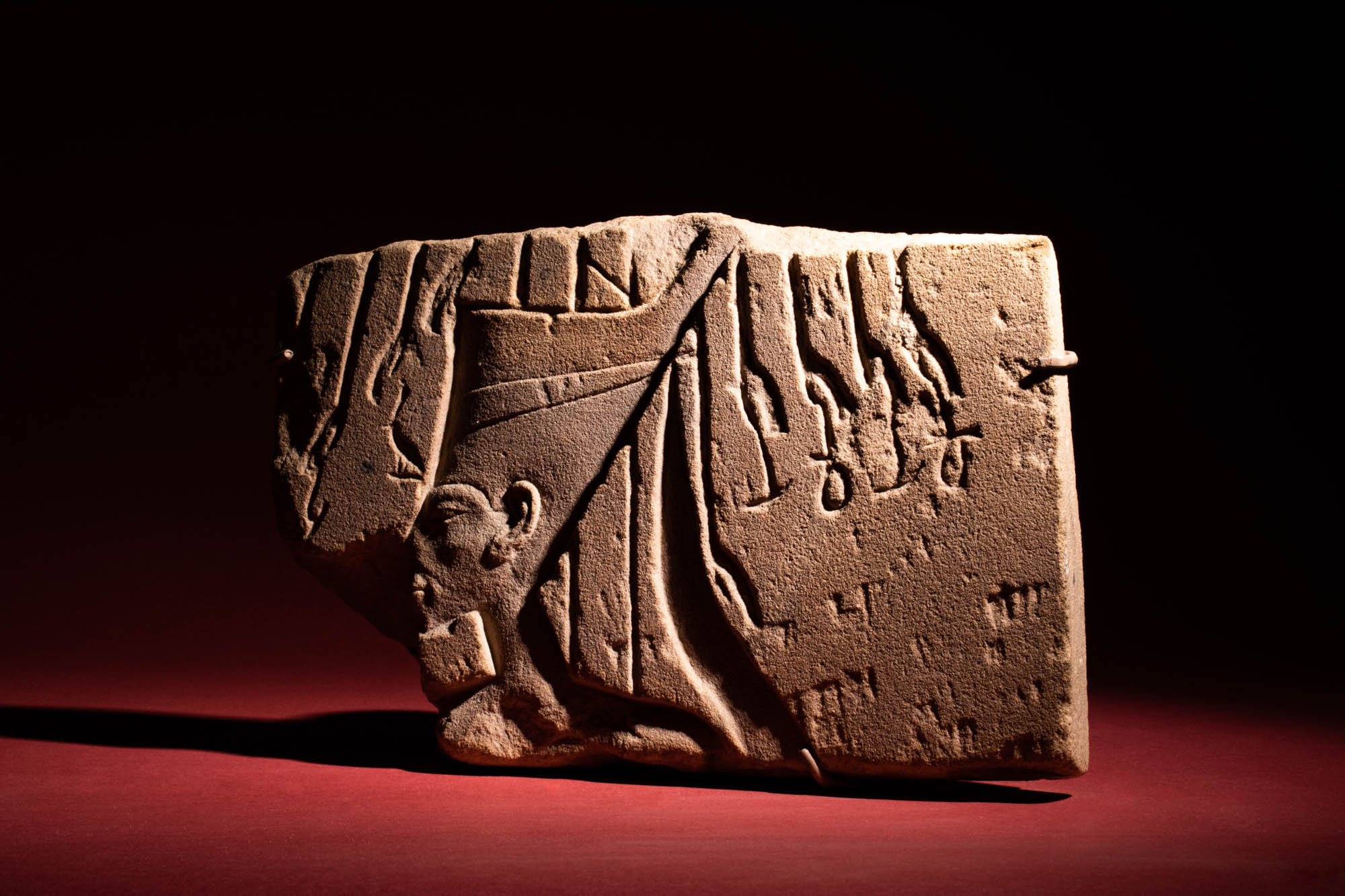 EGYPTIAN AMARNA PERIOD SANDSTONE RELIEF WITH A CROWNED PHARAOH