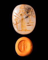 NEO - BABYLONIAN STAMP SEAL DEPICTING A STANDING GOD HOLDING A SCEPTRE