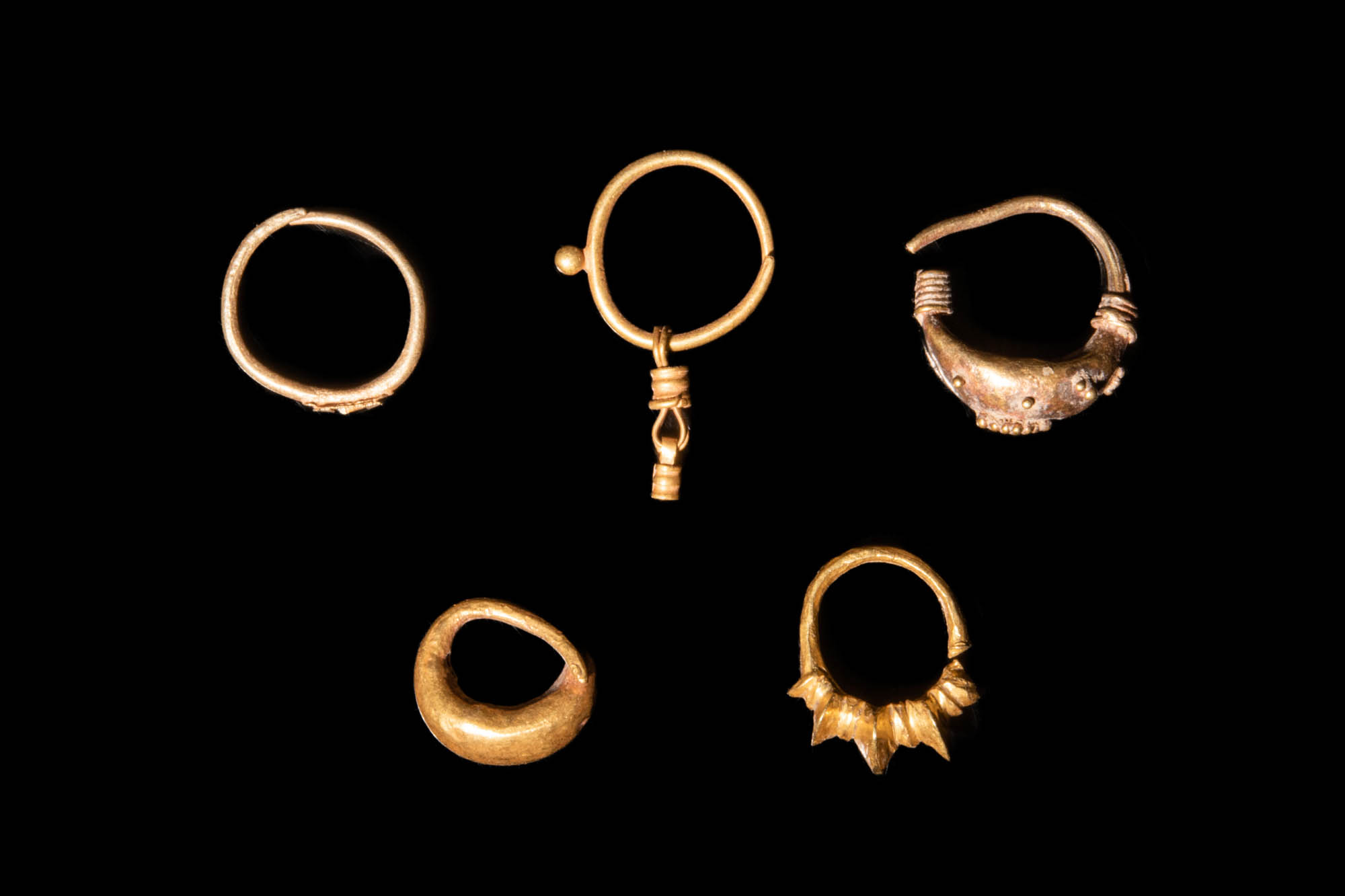 FIVE JAVANESE GOLDEN EARRINGS