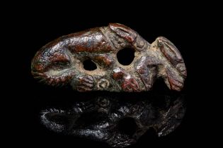 ROMAN BROOCH DEPICTING A WOLF EATING A RABBIT