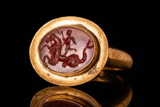 ROMAN GOLD INTAGLIO RING DEPICTING EROS RIDING HIPPOCAMPUS