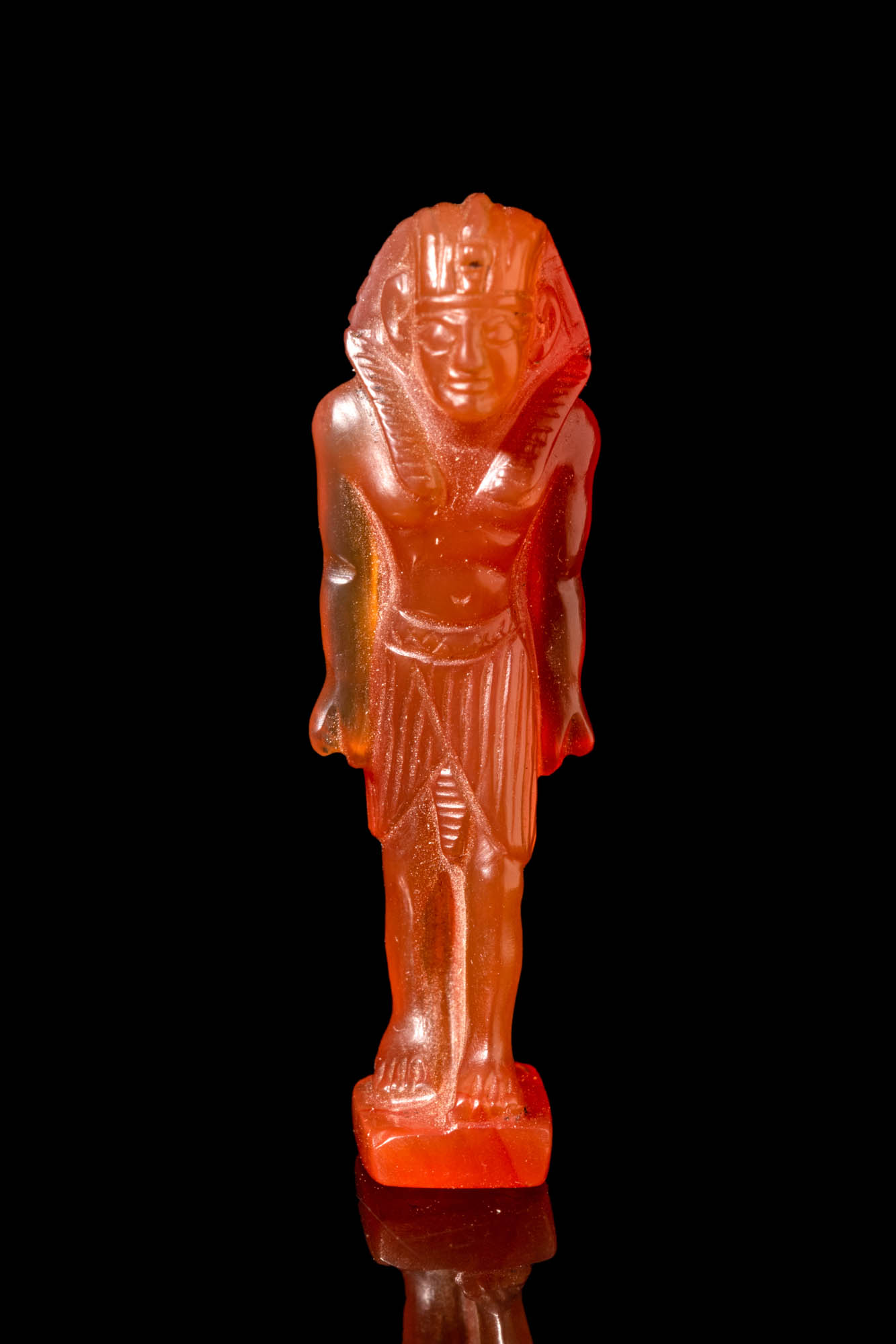 EGYPTIAN CARNELIAN AMULET OF STANDING PHARAOH