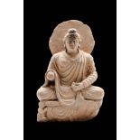 GANDHARAN GRAY SCHIST FIGURE OF A SEATED BUDDHA