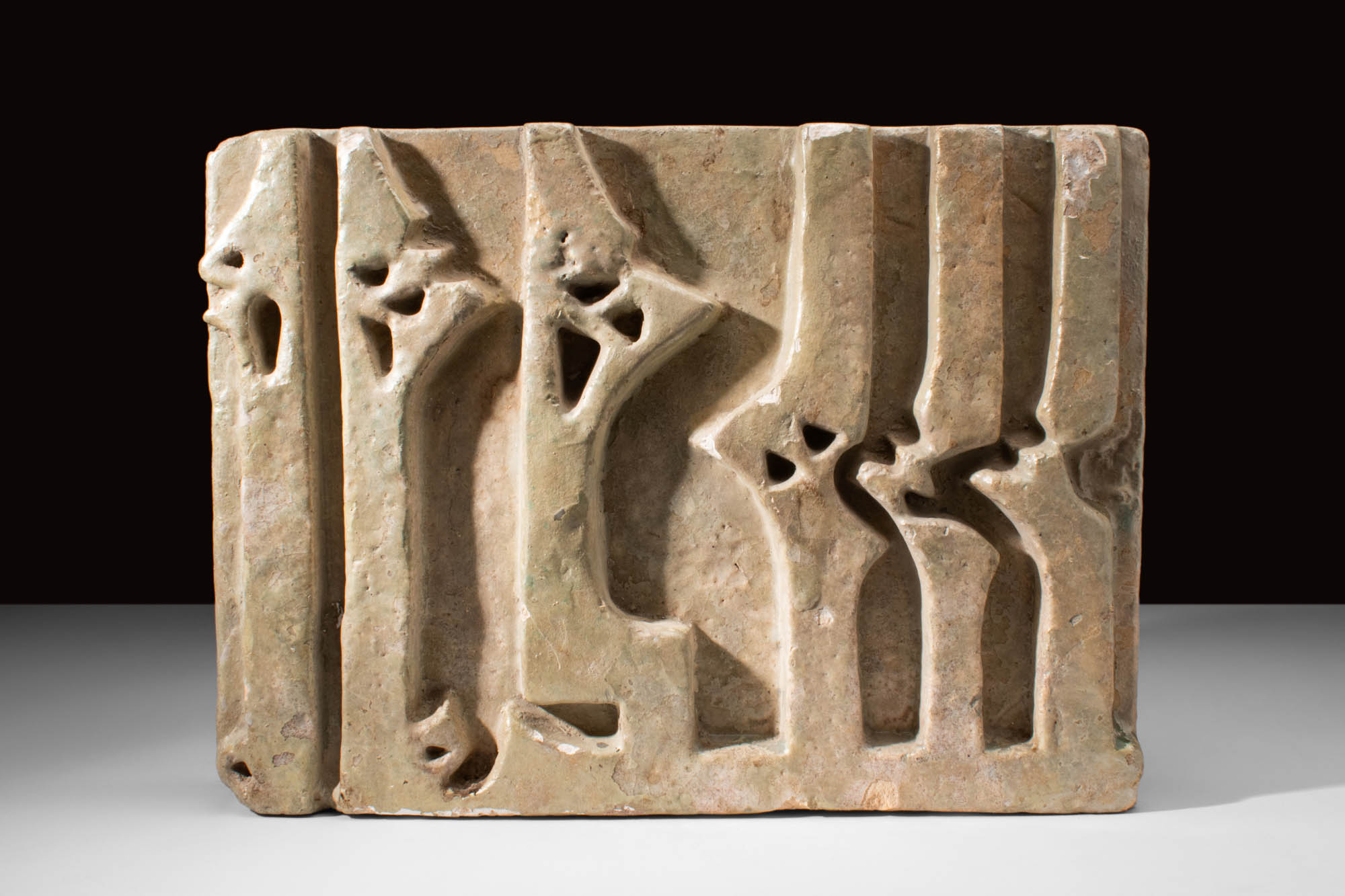 MEDIEVAL ABBASID STONE FRAGMENT WITH KUFIC INSCRIPTION