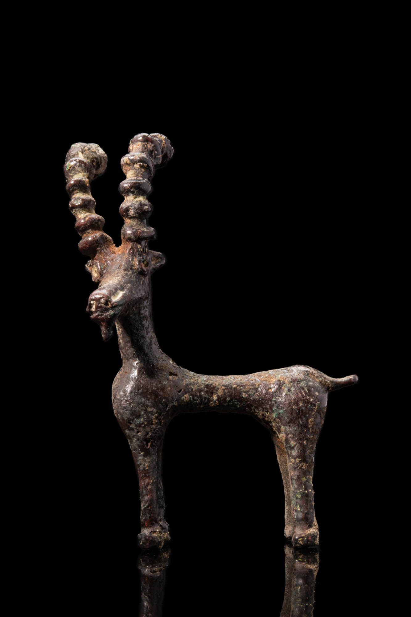 LARGE WESTERN ASIATIC BRONZE IBEX FIGURINE WITH INLAID EYES