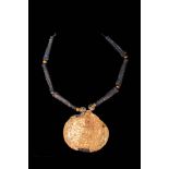 RARE ETRUSCAN NECKLACE WITH GOLD SUN PENDANT